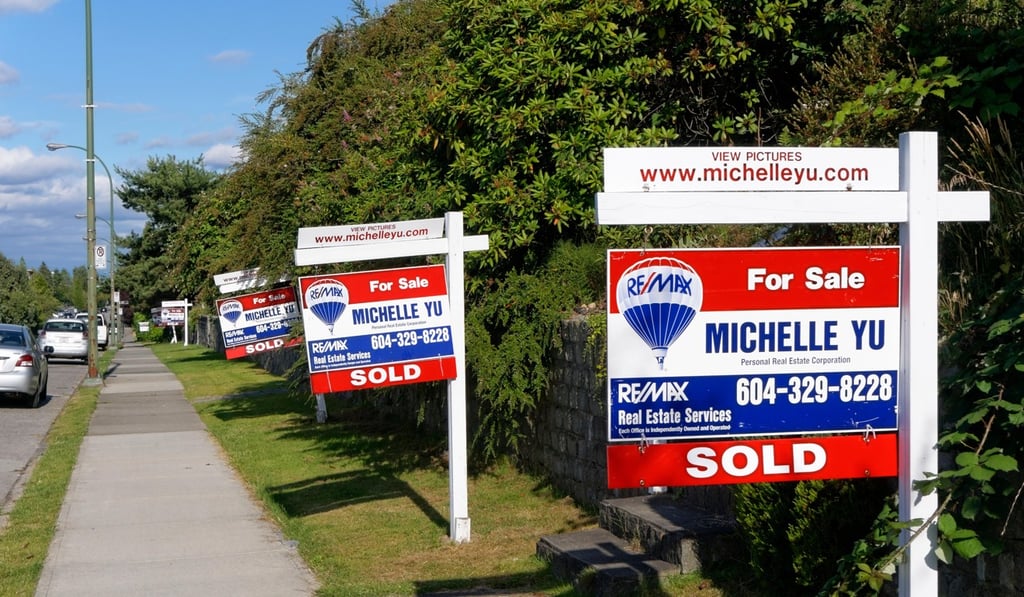 Real estate signs line a street in Vancouver. Photo: Alamy