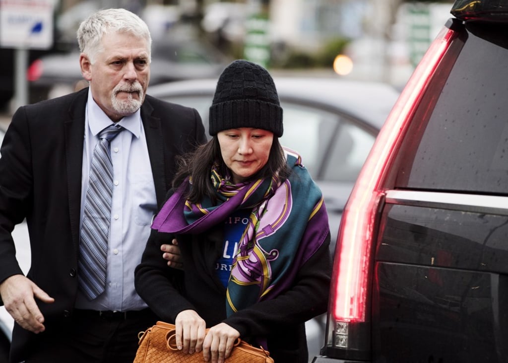 Meng Wanzhou arrives at a parole office with a security guard in Vancouver last Wednesday. Photo: AP