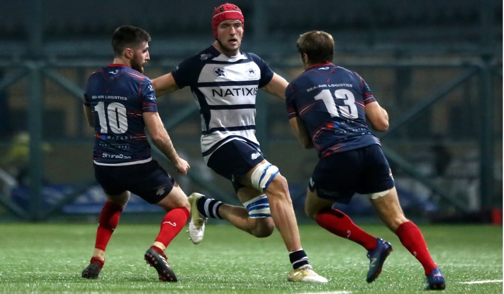 Fin Field tracking HK Scottish players while playing for the Hong Kong Football Club. Photo: Jonathan Wong