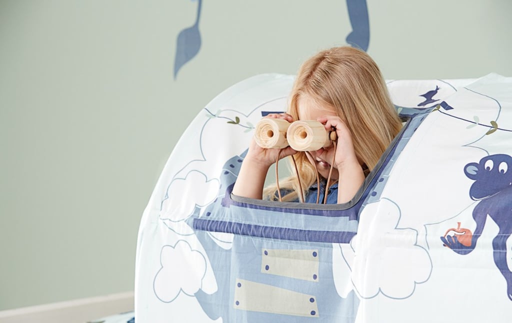 The Wild Safari tent from FELXA comes with a set of toy animals and wooden binoculars. The Wild Safari tent from FELXA comes with a set of toy animals and wooden binoculars.