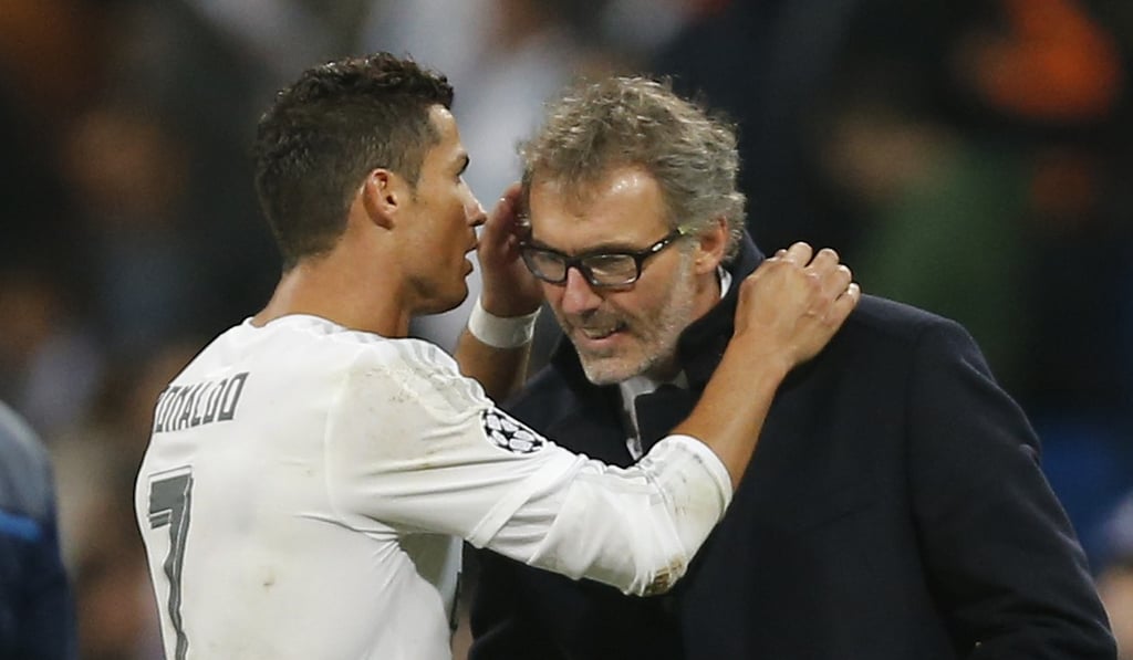 Real Madrid's Cristiano Ronaldo talks with PSG head coach Laurent Blanc in 2015. Photo: AP