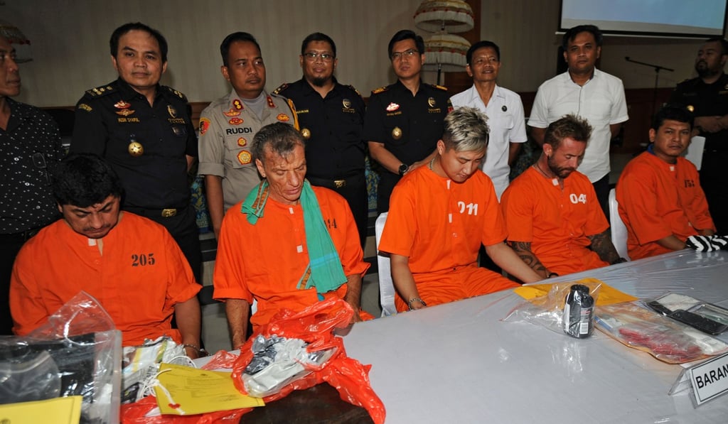 From left, Jorge Rafael Albornoz Gammara of Peru, Frank Zeidler of Germany, Cui Bao Lin of China, Briton Pip Holmes, and Hamdi Izham Hakimi of Malaysia, all suspected of smuggling or possessing drugs in Indonesia, are presented at a press conference in Denpasar on the resort island of Bali on Thursday. Photo: AFP