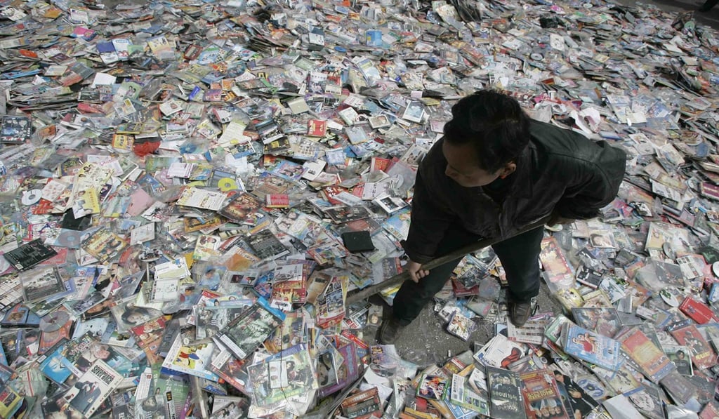 A worker prepares to destroy pirated CDs and DVDs in a campaign against piracy in Taiyuan, Shanxi province in 2010. Photo: Reuters