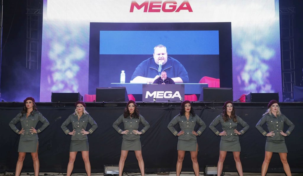 Kim Dotcom, center, launches his a file sharing site ‘Mega’ in Auckland in 2013. Photo: Reuters