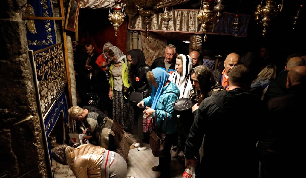 A group of tourists and pilgrims visit the Grotto, believed to be the exact spot where Jesus Christ was born. Photo: AFP