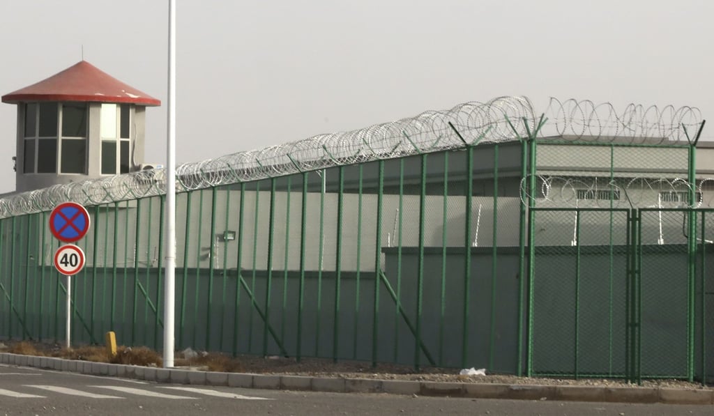 A guard tower and barbed wire fences around an internment facility in Artux, Xinjiang. Photo: AP A guard tower and barbed wire fences around an internment facility in Artux, Xinjiang. Photo: AP