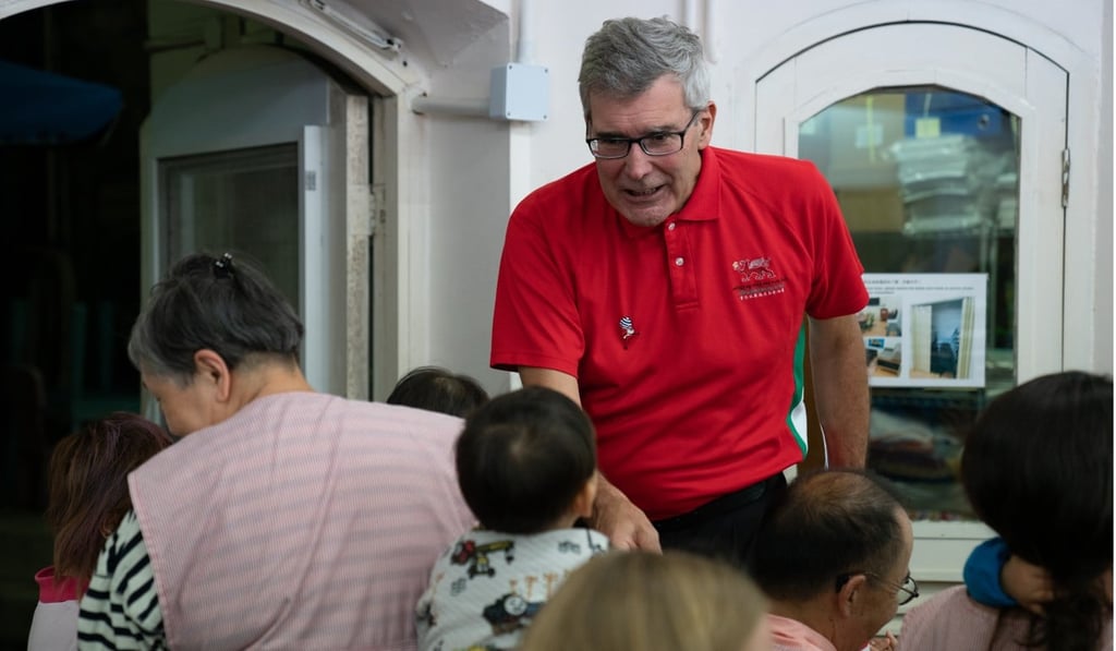 One of the children meets a member of the Hong Kong Male Welsh Choir during their visit to Mother’s Choice. Photo: courtesy of Mother’s Choice