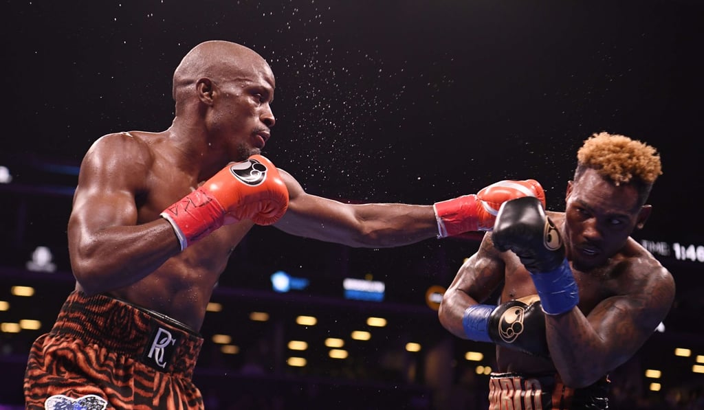 Tony Harrison punches Jermell Charlo during his win in their WBC super-welterweight championship bout at Barclays Centre in New York. Photo: AFP