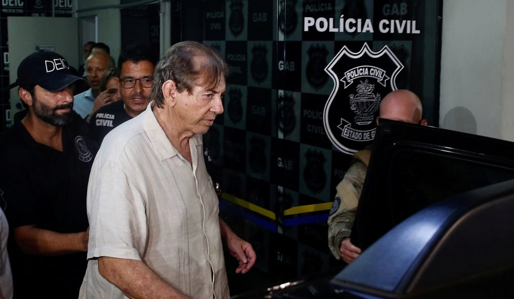 Brazilian spiritual healer Joao Teixeira de Faria arrives at a police station a day after being officially ruled a fugitive, in Goiania, Brazil. Photo: Reuters