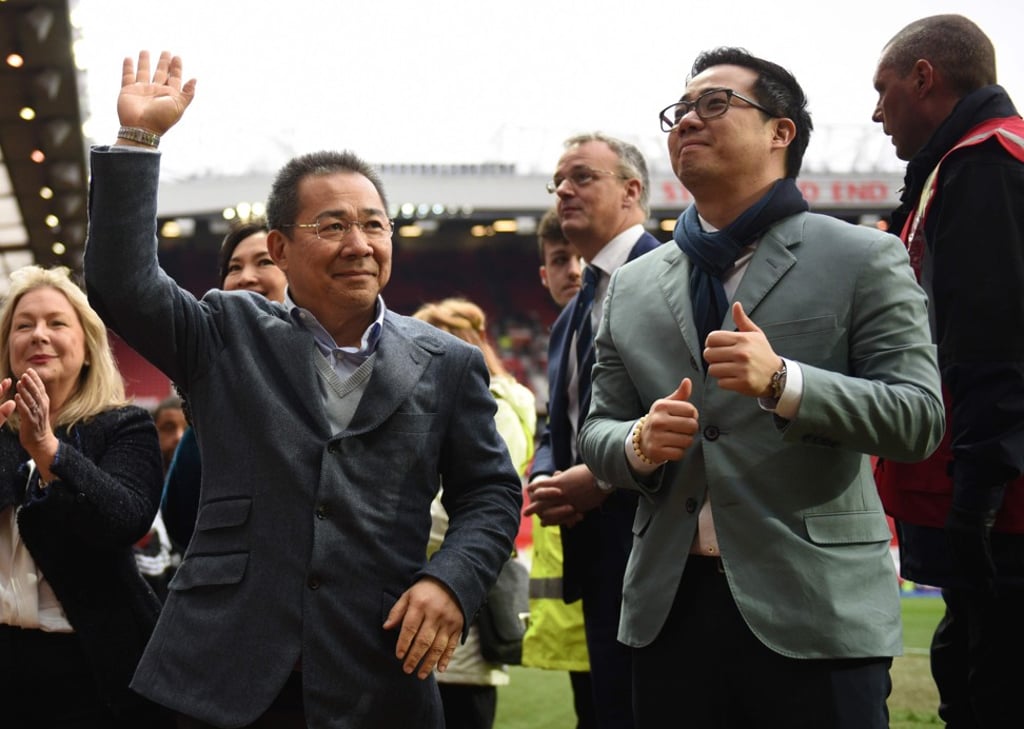 Vichai Srivaddhanaprabha (left), the late Leicester City chairman, and his son Aiyawatt acknowledge fans after the unfashionable Foxes had won English soccer’s most prestigious title for the first time in its history. Photo: AFP