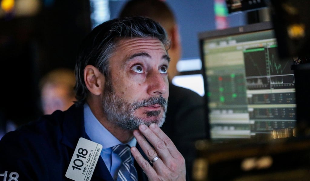 Traders work on the floor of the New York Stock Exchange on Wednesday. Photo: Reuters