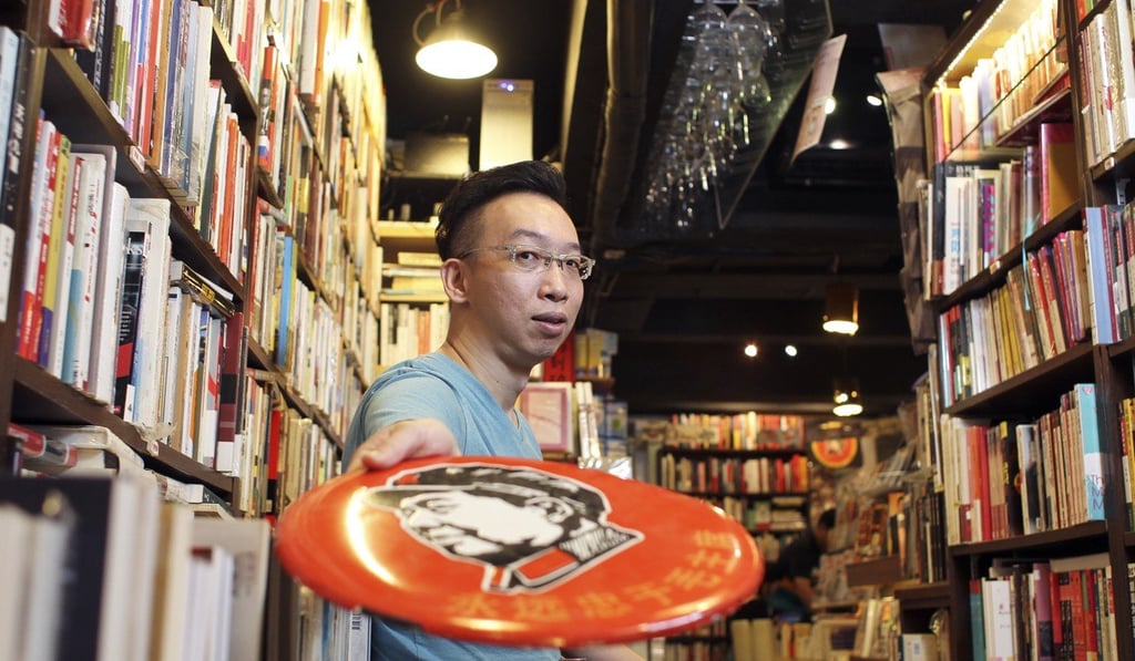 People’s Books Cafe owner Paul Tang at his former shop in Russell street, Causeway Bay in 2014. Photo: May Tse