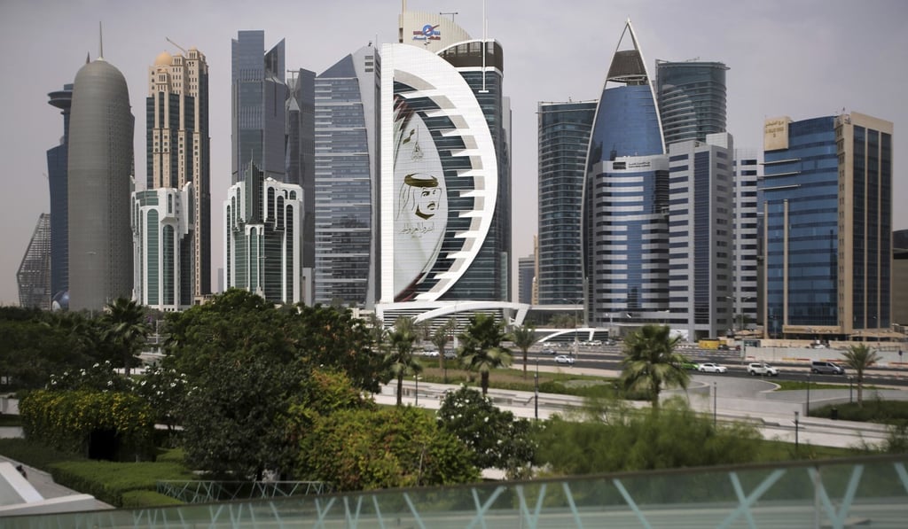 A giant image of the Emir of Qatar, Sheikh Tamim bin Hamad al-Thani, adorns a tower in Doha, Qatar. Qatar’s withdrawal from Opec highlights its long-term strategy to diversify its resources and position itself for economic opportunities in the 21st century. Photo: AP A giant image of the Emir of Qatar, Sheikh Tamim bin Hamad al-Thani, adorns a tower in Doha, Qatar. Qatar’s withdrawal from Opec highlights its long-term strategy to diversify its resources and position itself for economic opportunities in the 21st century. Photo: AP