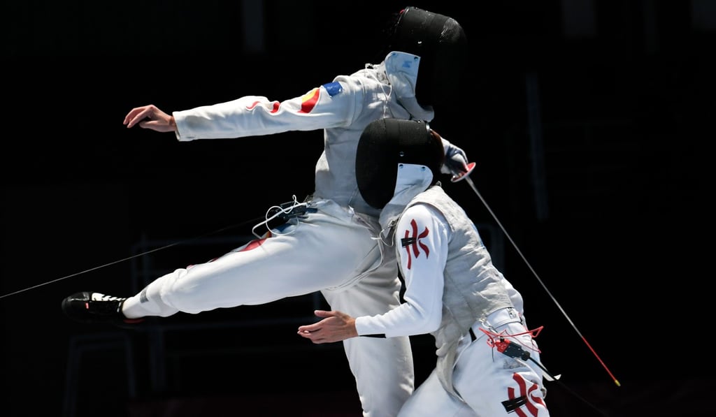China’s Huang Mengkai (left) competes against Hong Kong’s Nicholas Choi in their fencing foil individual final at the 2018 Asian Games in Jakarta. Photo: AFP