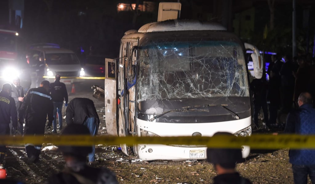 A tourist bus wrecked by a bomb blast is seen on the outskirts of the Egyptian capital of Cairo on Friday. Photo: AFP A tourist bus wrecked by a bomb blast is seen on the outskirts of the Egyptian capital of Cairo on Friday. Photo: AFP