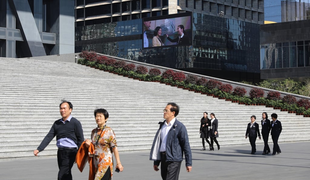 People walking in the commercial area in Futian, Shenzhen. Photo: Sam Tsang