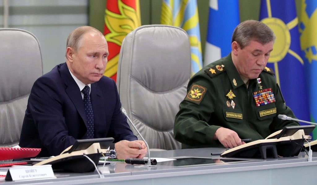 Russian President Vladimir Putin and Head of the Russian Armed Forces General Staff Army General Valery Gerasimov at the National Defence Control Centre in Moscow on December 26, 2018. Photo: EPA