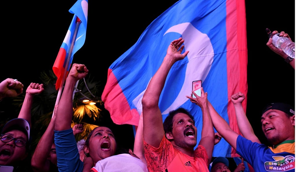 Supporters celebrate Mahathir’s election victory in May. Photo: Reuters