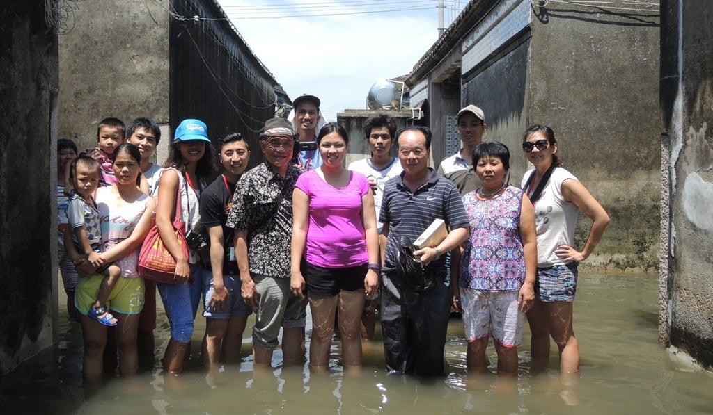 Chery Tien, with villagers from her ancestral home, takes part in a programme called Friends of Roots that helps young people learn more about their Chinese heritage.
