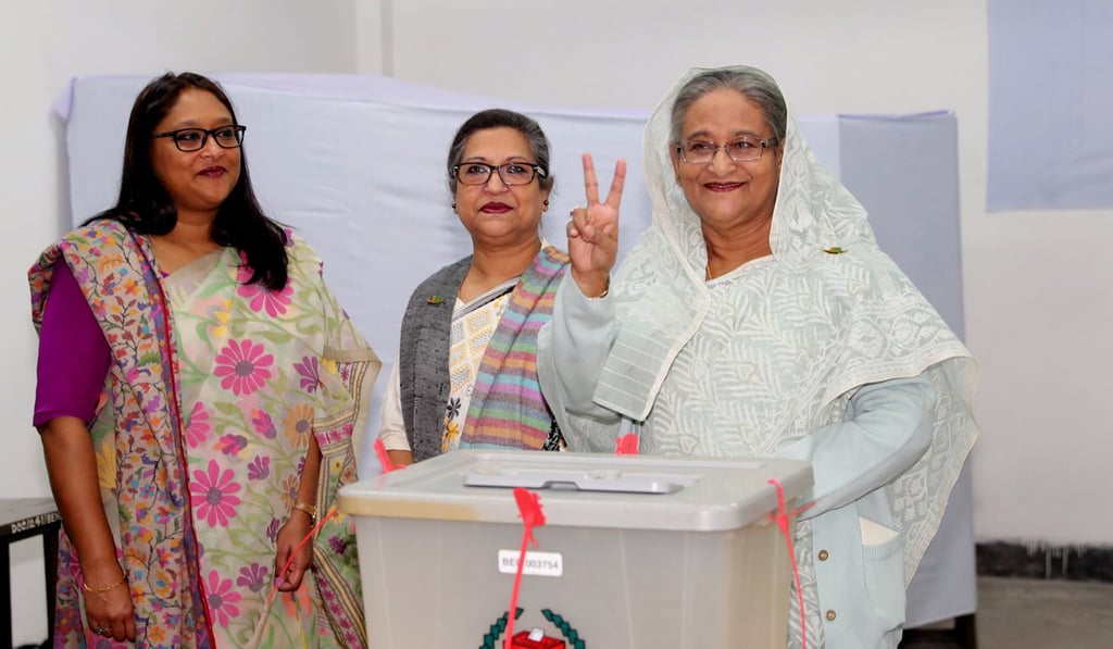 Prime Minister Sheikh Hasina gestures after casting her vote in the morning during the general election in Dhaka on Sunday. Photo: Reuters