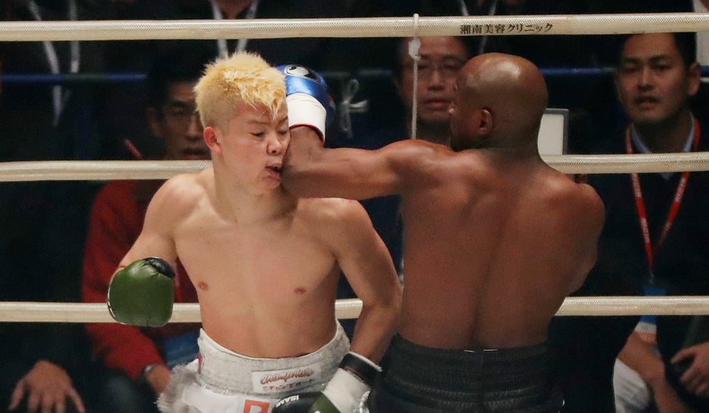Floyd Mayweather in action with Tenshin Nasukawa. Photo Reuters