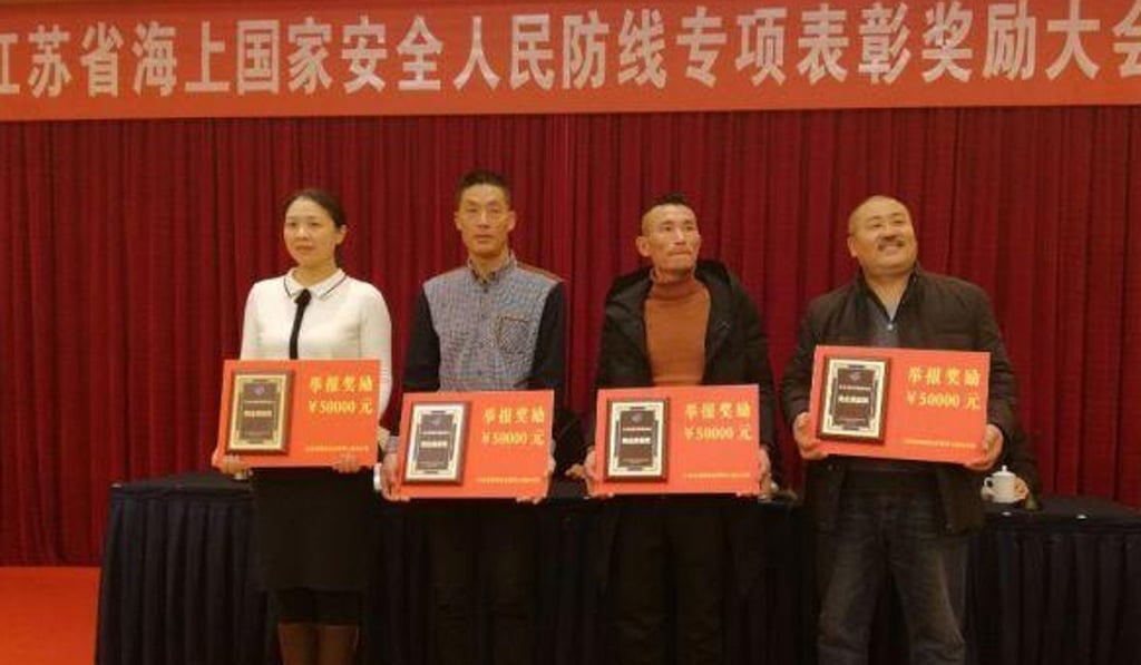 Nine ‘suspicious underwater devices’ were discovered and reported by Jiangsu fisherman, who were honoured in a ceremony organised by provincial authorities. Photo: Handout