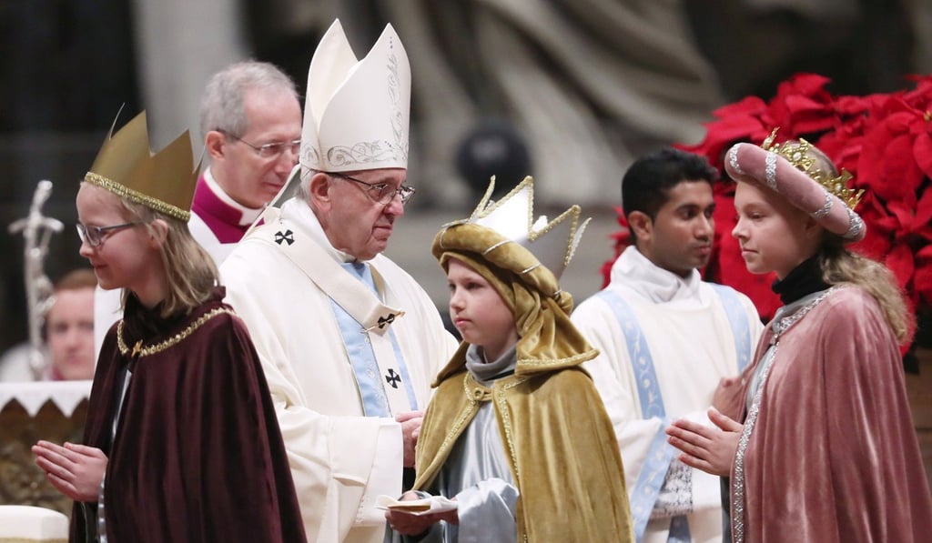 The pope with children dressed as the Three Wise Men. Photo: Reuters
