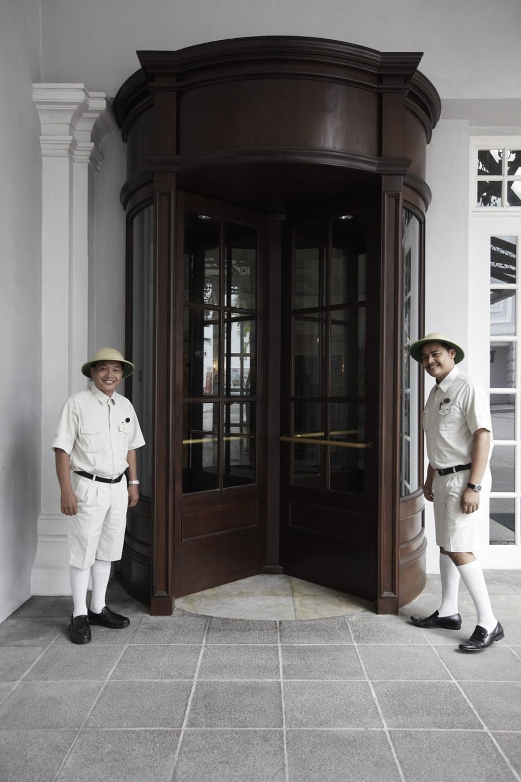 Staff dressed in colonial shorts, socks and pith helmets greet guests at the door. Picture: Eastern & Oriental Hotel, Penang, Malaysia