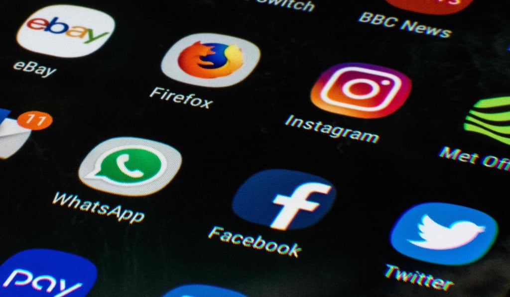 A mobile phone screen displays the icons for the social networking apps Facebook, Twitter and Instagram. Photo: AFP Photo