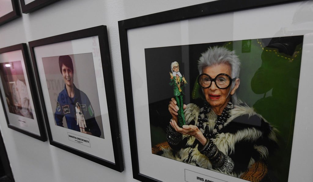 Framed portraits of famous Barbie designers. Photo: AFP