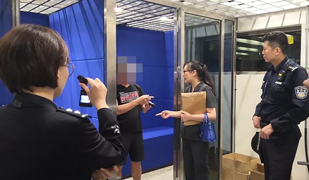 Mainland Chinese officials take away a traveller (second from left, face pixelated) from the West Kowloon high-speed rail terminal in Hong Kong on October 27, 2018. Photo: Southern Metropolis Daily