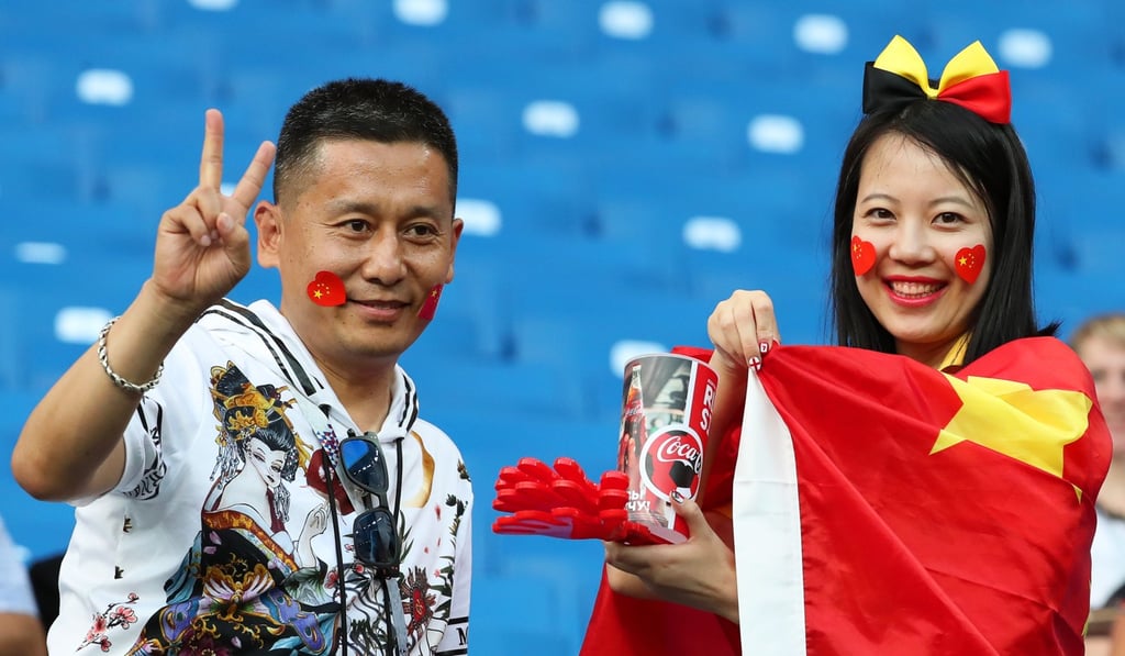 Chinese football fans pose at a World Cup 2018 game in Russia. Photo: EPA