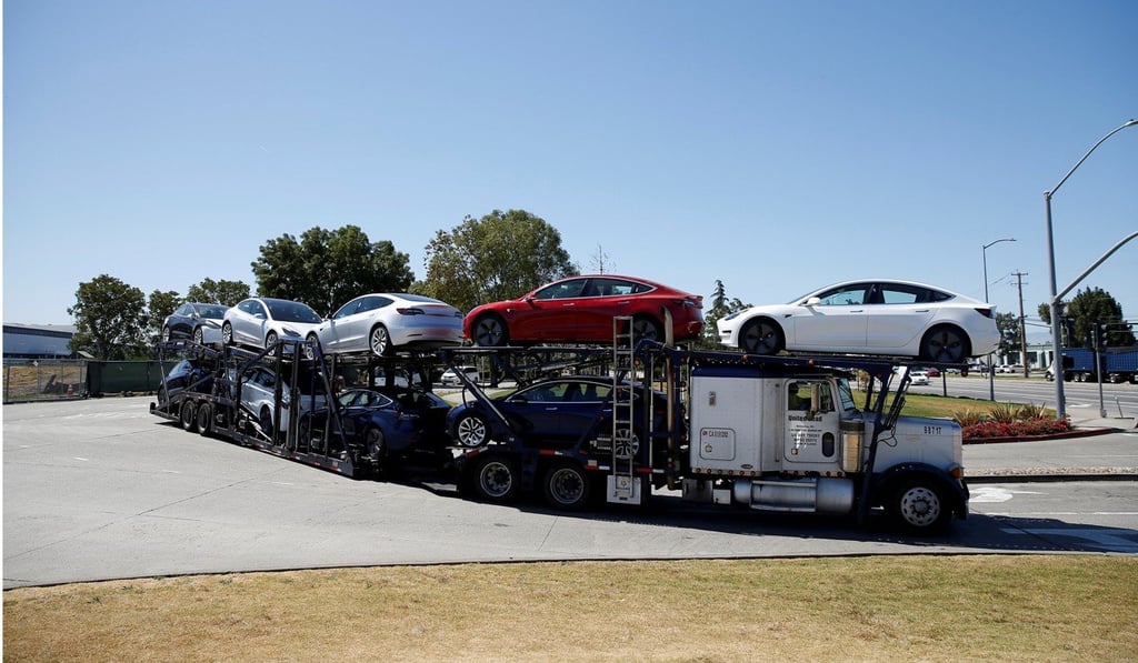 File photo of a car carrier full of Tesla Model 3 electric cars. Photo: Reuters