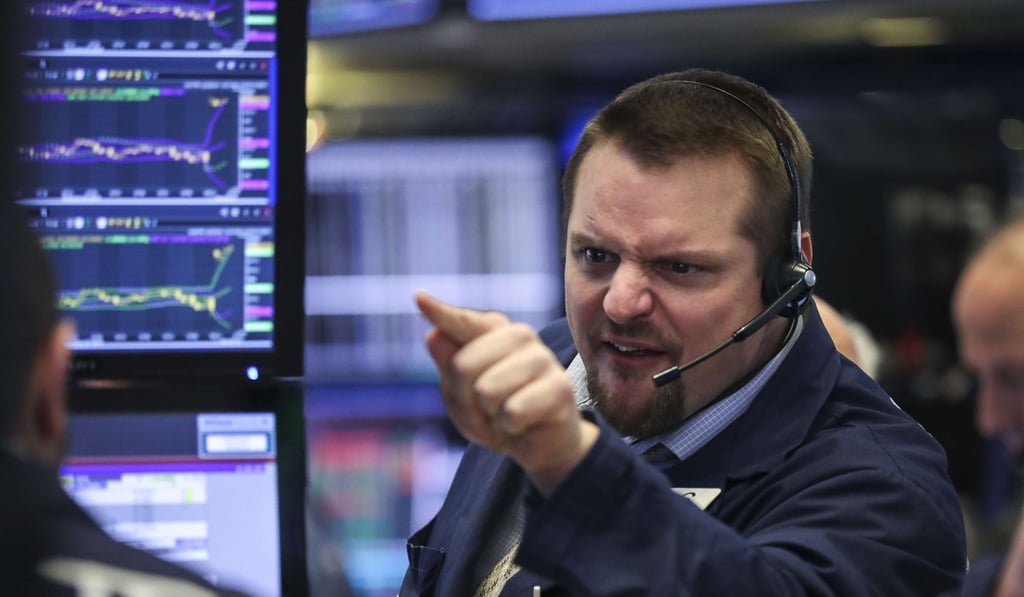 A trader works on the floor of the New York Stock Exchange on Friday. Photo: AFP A trader works on the floor of the New York Stock Exchange on Friday. Photo: AFP