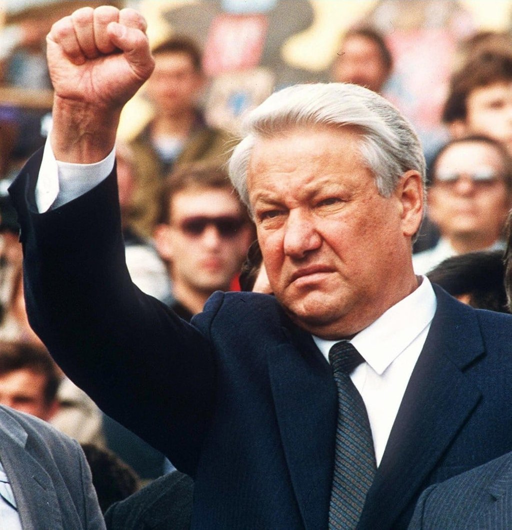 Russian president Boris Yeltsin holds up a clenched fist on August 24, 1991, at the funeral of three young men killed during an abortive coup against then Soviet president Mikhail Gorbachev. The unsuccessful coup sealed the fate of the Soviet Union. Photo: AFP