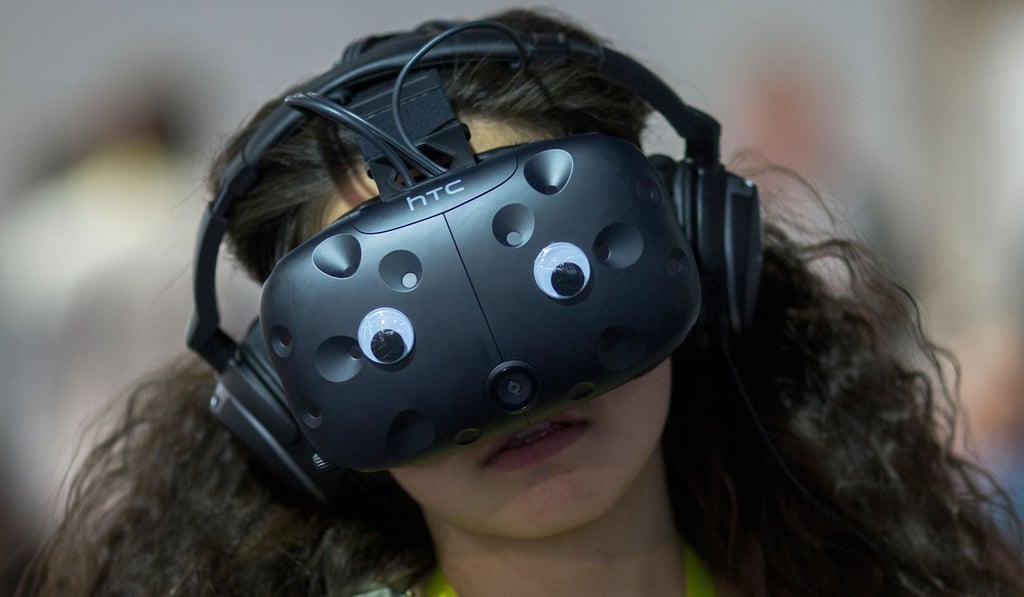 In this file photo taken on January 7, 2017, a woman wears a FLIR Virtual Reality Simulator during CES in Las Vegas, Nevada. Photo: AFP