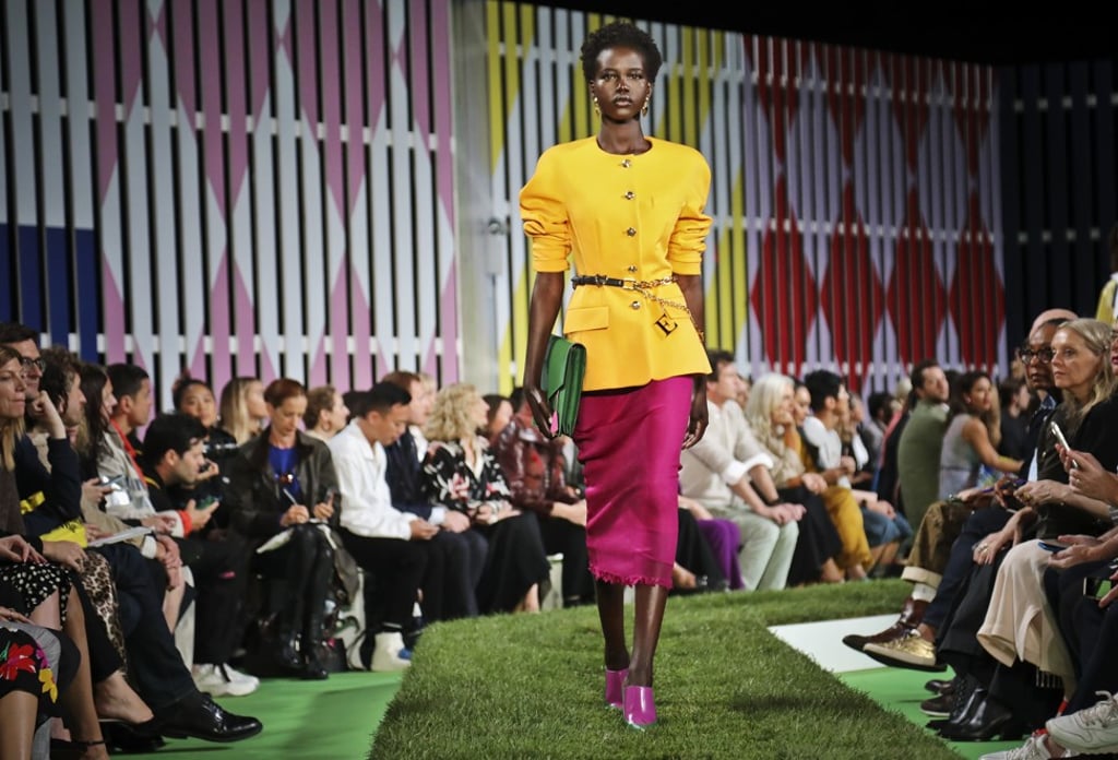 Escada’s buttercup-coloured raincoats over yellow and pink dresses. Photo: Bebeto Matthews / AP Escada’s buttercup-coloured raincoats over yellow and pink dresses. Photo: Bebeto Matthews / AP