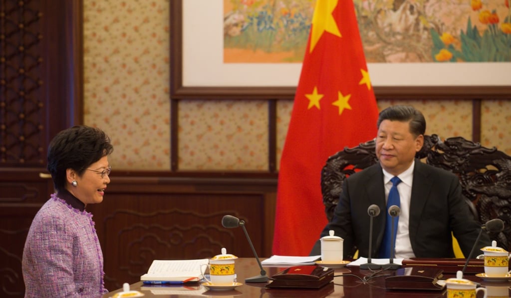 During a meeting in Beijing on December 17, Chief Executive Carrie Lam briefs President Xi Jinping on the latest economic, social and political situation in Hong Kong. Photo: Handout