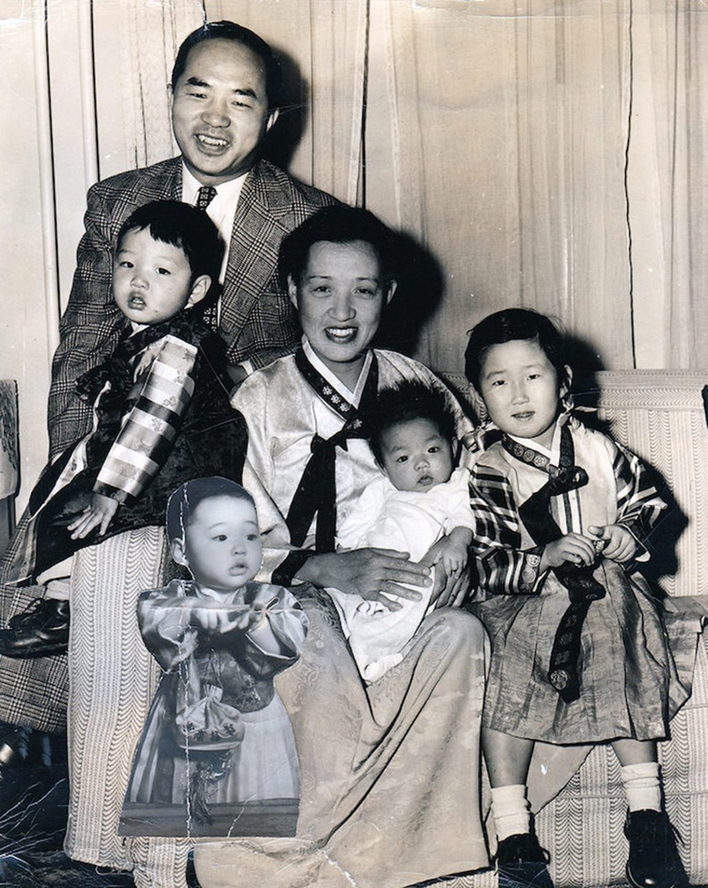A portrait of the author’s family, taken in 1949-50, with a cut-out photo of missing daughter Sun pasted on top. Picture: courtesy of Eugenia Kim