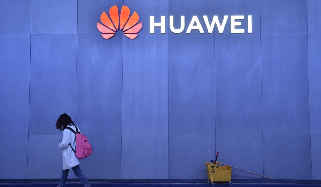 An attendee walks by the Huawei booth at the CES 2019 consumer electronics show at the Las Vegas Convention Centre on Tuesday. Photo: AFP