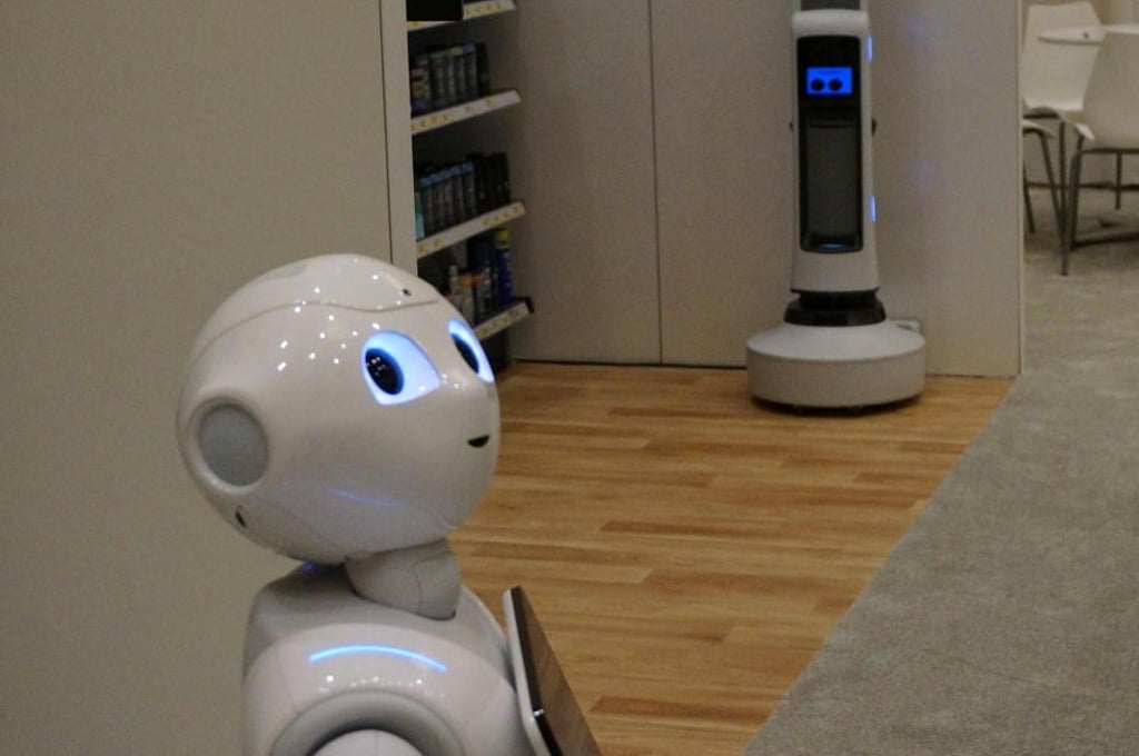 SoftBank Robotics says its Pepper robot, left, could be used in hotels where an automated facial recognition system helps deliver a customised experience to a regular guest. Photo: Agence France-Presse SoftBank Robotics says its Pepper robot, left, could be used in hotels where an automated facial recognition system helps deliver a customised experience to a regular guest. Photo: Agence France-Presse