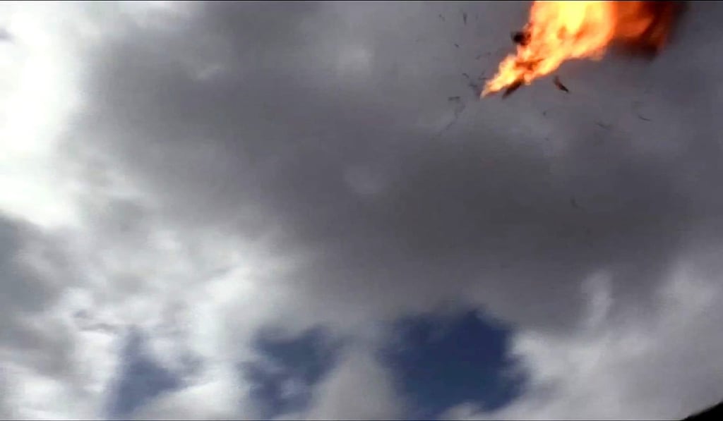 An image grab taken from a video obtained by AFPTV shows the moment a drone exploded above Yemen's al-Anad airbase in the government-held southern province of Lahj on January 10, 2019. Photo: AFP