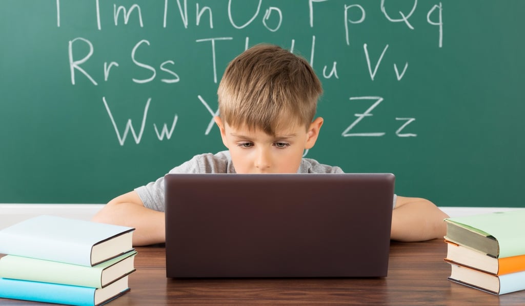Should students use laptops in tests at school? Photo: Alamy