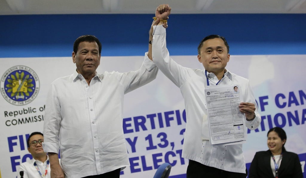 Philippine President Rodrigo Duterte with Christopher ‘Bong’ Go. Photo: AP