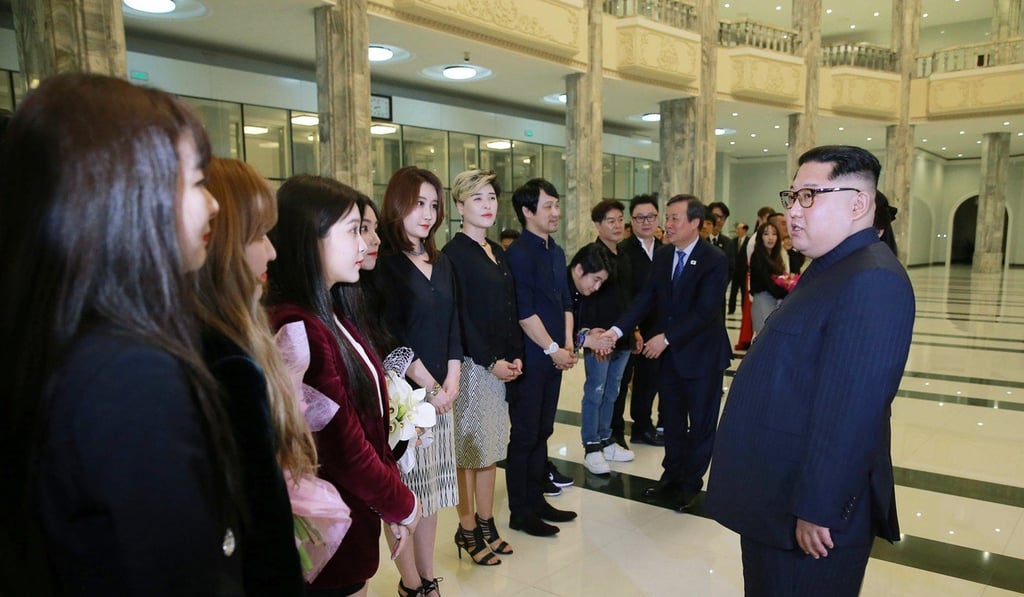 North Korean leader Kim Jong-un talks to members of Red Velvet after their performance in East Pyongyang Grand Theatre in Pyongyang. Photo: AP