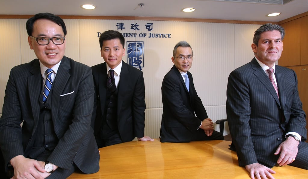Home-grown talent (from left to right), William Tam, Martin Hui, David Leung, and Wayne Walsh, deputy Law officer, at the justice department’s offices. Photo: Handout
