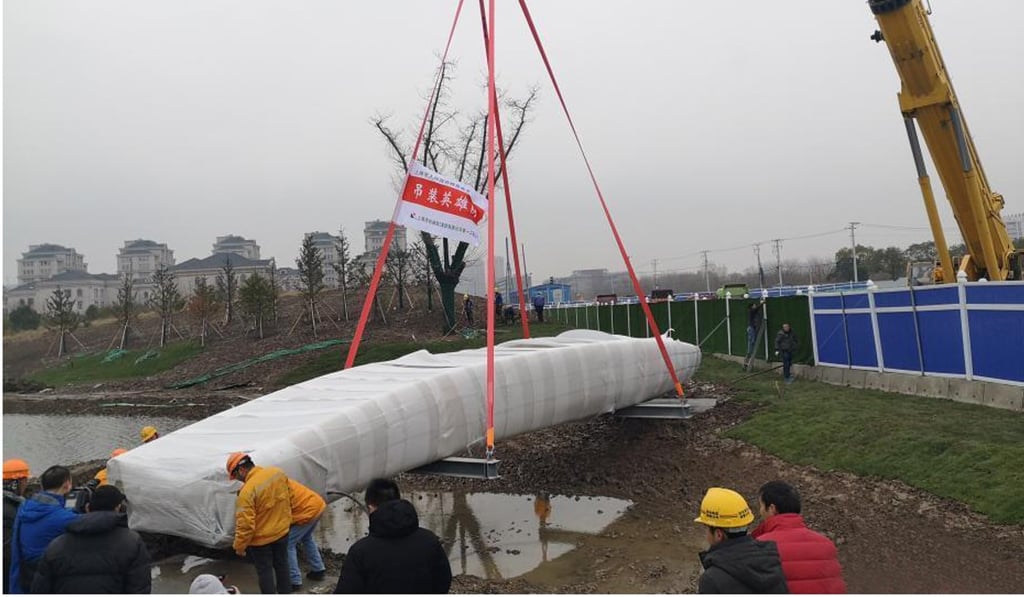 The new bridge is lowered into place. Photo: CNA