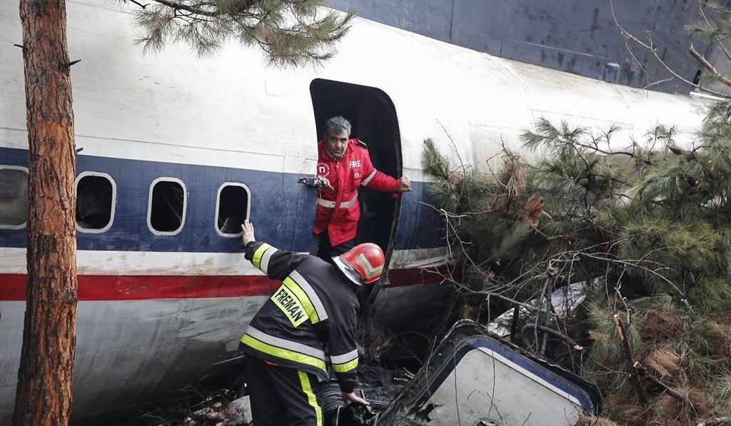 Firefighters and security forces search the debris. Photo: AFP Firefighters and security forces search the debris. Photo: AFP
