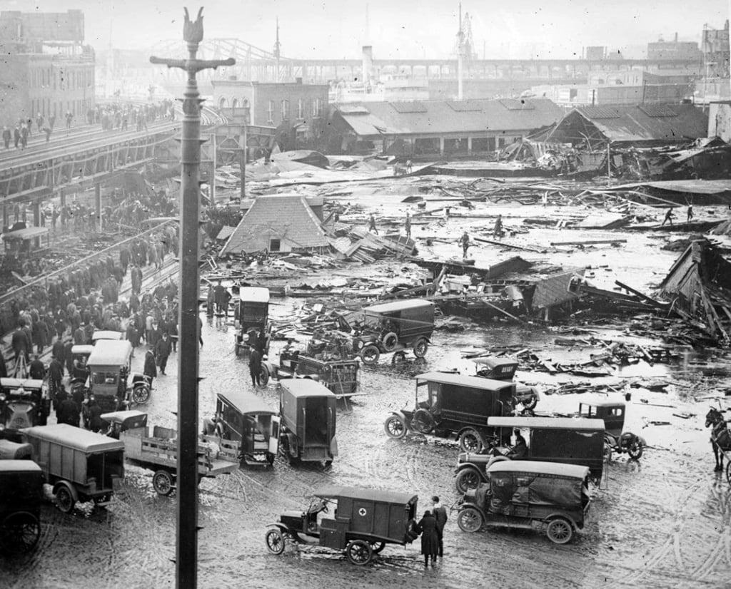 The scene in Boston's North End on Jan. 15, 1919, after a massive tank holding molasses ruptured. The ensuing flood of 2.3 million gallons killed 21 and injured 150. MUST CREDIT: Library of Congress Prints and Photographs Division The scene in Boston's North End on Jan. 15, 1919, after a massive tank holding molasses ruptured. The ensuing flood of 2.3 million gallons killed 21 and injured 150. MUST CREDIT: Library of Congress Prints and Photographs Division