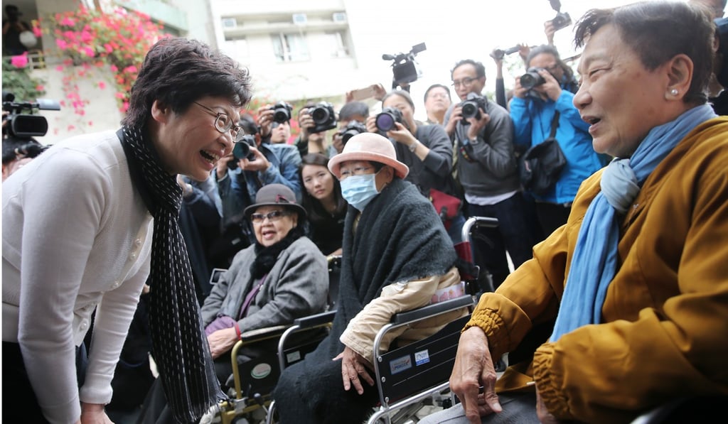 Lam (left) meets residents in Hung Hom in March 2017. Photo: Sam Tsang